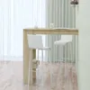 A bar table with two bar stools in front of a window with sheer curtains. Produktbild-Vorschau