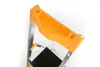 Close-up view of the top part of an orange and silver step stool, showing the tool tray. Anteprima dell’immagine prodotto