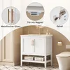 A collage of images showcasing a white bathroom vanity with gold hardware, highlighting its features like metallic finish, magnetic door closure, and hinge detail, alongside a view of the vanity in a bathroom setting with a toilet. Voir les images du produit