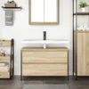 A bathroom vanity with a sink and faucet. Voir les images du produit
