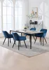 A dining set with four blue chairs and a gray table in a well-lit room with large windows. Náhľad obrázku produktu