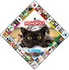 A diamond-shaped Monopoly board game with a large black cat in the center, surrounded by various cat-themed squares. Produktbild-Vorschau
