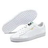 A pair of white Puma Basket Classic XXI Uni sneakers shown from a slightly elevated side angle, with one shoe placed in front of the other. Produktbild-Vorschau