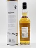 A bottle of An Cnoc 12 Years Old Highland Single Malt Scotch Whisky stands next to its cylindrical packaging. Produktbild-Vorschau