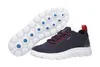 A pair of navy blue Geox Spherica sneakers with red accents and a white sole, shown from a side angle with the sole detached and placed next to the shoe. Produktbild-Vorschau