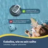 A pool cleaner is shown in a pool with a person relaxing in the water. Náhľad obrázku produktu