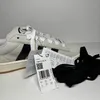 A pair of Adidas Campus 00s sneakers with tags and extra laces. Voir les images du produit