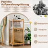 A bamboo laundry basket with shelves, shown with items organized on it, contrasted with a pile of laundry. Podgląd zdjęcia produktu