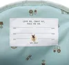 A close-up view of the inside lining of a backpack, featuring a label with text and graphics. Produktbild-Vorschau