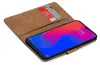 A brown book-style phone case with two cards inserted, showing a smartphone screen. Produktbild-Vorschau