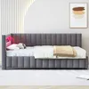 A dark gray upholstered bed with pink LED lighting on the headboard, set against a white and striped wall. Náhled obrázku produktu