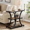 A side table next to a sofa in a living room. Produktbild-Vorschau