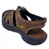 A brown KEEN sandal is shown from a side-angle on a white background. Produktbild-Vorschau