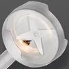 Close-up of the blades of a hand mixer, with glowing orange lines indicating motion. Podgląd zdjęcia produktu
