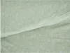 A close-up view of a light green fabric with a delicate white floral pattern. Produktbild-Vorschau