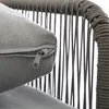 A close-up view of a gray cushion with a zipper on a chair with a woven frame. Podgląd zdjęcia produktu