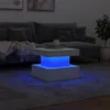 A modern coffee table with LED lighting in a living room setting. Produktbild-Vorschau