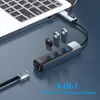 A laptop connected to a USB hub with an Ethernet cable and USB drives. Produktbild-Vorschau