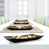 Pórční talíř z černého matného porcelánu, rozměry 29 x 15 Náhled obrázku produktu 5
