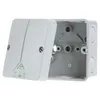 A light gray electrical junction box with its lid open, showing the interior mounting points. The lid is slightly ajar and shows some green symbols and text. Náhled obrázku produktu