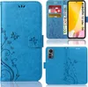 A collage of images showing a blue flip phone case with a floral and butterfly design, including views of the case open with credit cards and cash, and the back of the case with the phone inserted. Produktbild-Vorschau