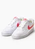 A pair of white Nike Court Vision Lo NN sneakers with coral Nike swoosh logos and branding, displayed against a white background. Produktbild-Vorschau