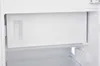 Interior view of a white refrigerator compartment, showing a pull-out drawer and a power strip on the side. Produktbild-Vorschau