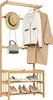 A wooden coat rack with shelves displaying clothing and accessories. Náhled obrázku produktu