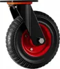 A close-up of a black and red caster wheel with a black tire and a red rim. Voir les images du produit