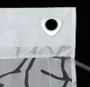 A close-up view of a white curtain with a decorative pattern and a silver grommet. Produktbild-Vorschau