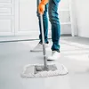 A person is mopping the floor. Podgląd zdjęcia produktu