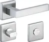 A set of stainless steel door handles and related hardware on a white background. Produktbild-Vorschau