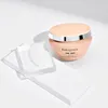 A product shot of a hair mask jar and some acrylic blocks on a white surface. Náhled obrázku produktu