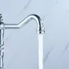 A close-up shot of a chrome faucet with water running. Náhled obrázku produktu