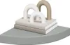 A decorative shelf with books and abstract sculptures. Produktbild-Vorschau