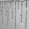 A string of LED lights hanging against a light gray wall. Podgląd zdjęcia produktu