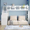 A white loft bed with stairs and a sofa underneath, set against a light blue wall. Produktbild-Vorschau