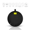 A black, round Bluetooth speaker with a yellow accent is shown against a white background. Above the speaker are several circular icons with text labels indicating features. Produktbild-Vorschau