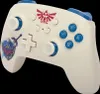 A white Nintendo Switch controller with blue accents and The Legend of Zelda-themed graphics. Anteprima dell’immagine prodotto