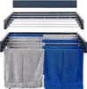A wall-mounted drying rack with towels hanging on it. Produktbild-Vorschau