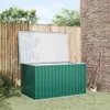 A green garden storage box with its lid open, placed on a lawn next to a wooden fence and a brick wall. Gardening tools are leaning against the wall. Produktbild-Vorschau