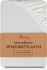 A white fitted sheet with a brown label indicating product details. Produktbild-Vorschau
