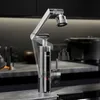 A modern kitchen faucet with a digital display is shown on a countertop. Produktbild-Vorschau