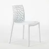A white plastic chair with a web-like pattern on the back and seat, shown in a studio setting against a white background. Produktbild-Vorschau