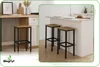 Two bar stools are placed in front of a kitchen island, with a third stool visible to the left. Produktbild-Vorschau
