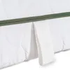 A close-up view of a white mattress with a green zipper and a white fabric handle. Náhľad obrázku produktu