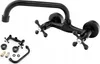 A black wall-mounted kitchen faucet with two cross-shaped handles and a curved spout, shown with some accessories in the lower left corner. Náhled obrázku produktu
