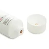 A white tube of grease with its white cap off, placed next to it. The tube has text and branding on it. Anteprima dell’immagine prodotto