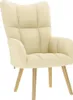 A cream-colored fabric armchair with wooden legs, shown against a white background. Náhľad obrázku produktu
