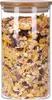 A clear, well-lit studio shot of a glass jar filled with muesli. Produktbild-Vorschau